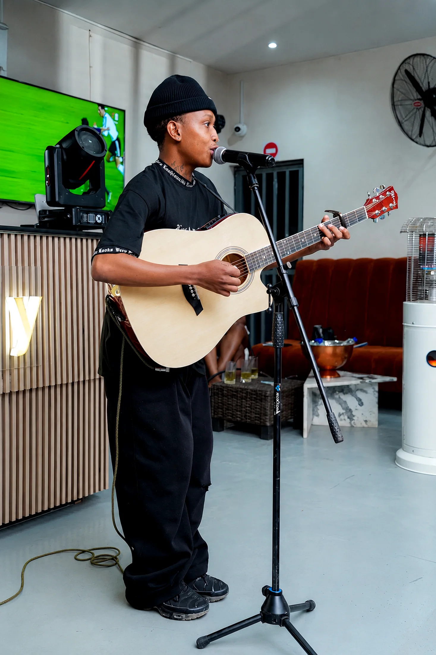 Mahlatse Chokoe live acoustic performance full-body portrait